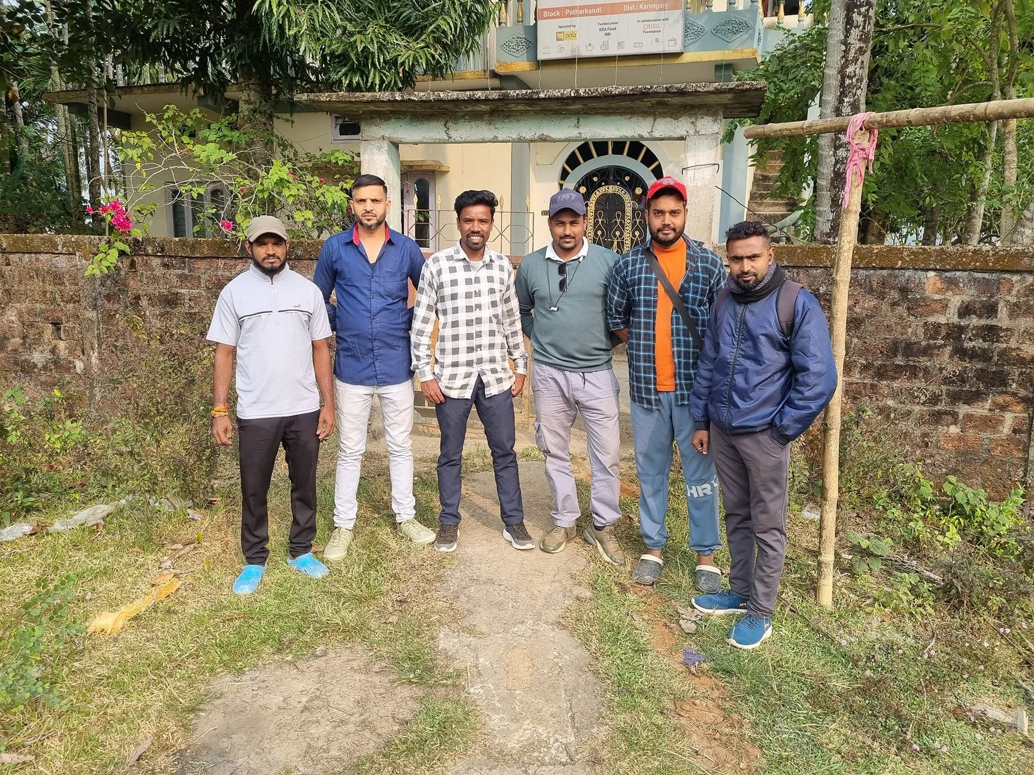 Ground coordination team assembled outside community outreach center in Karimganj district